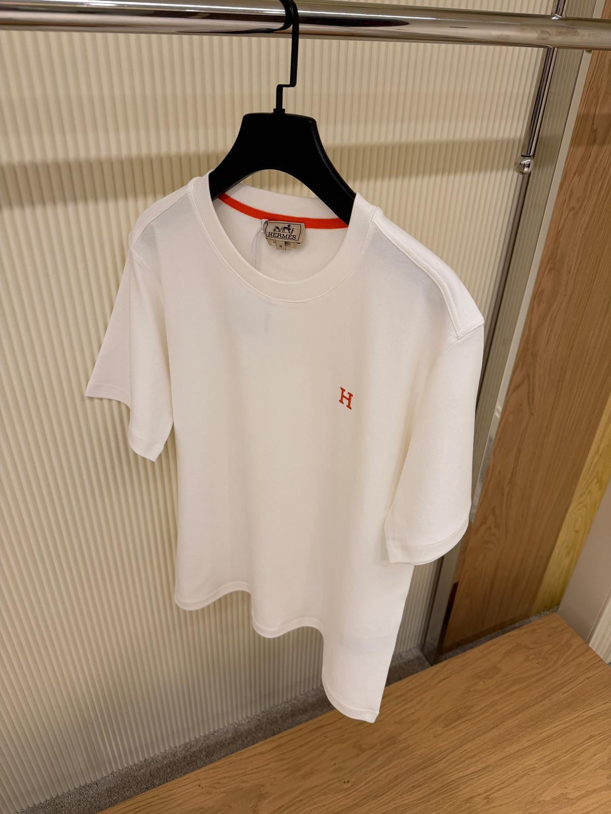 White T-shirt with Orange Logo